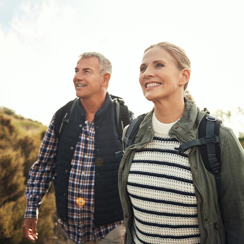 smiling senior couple on walk